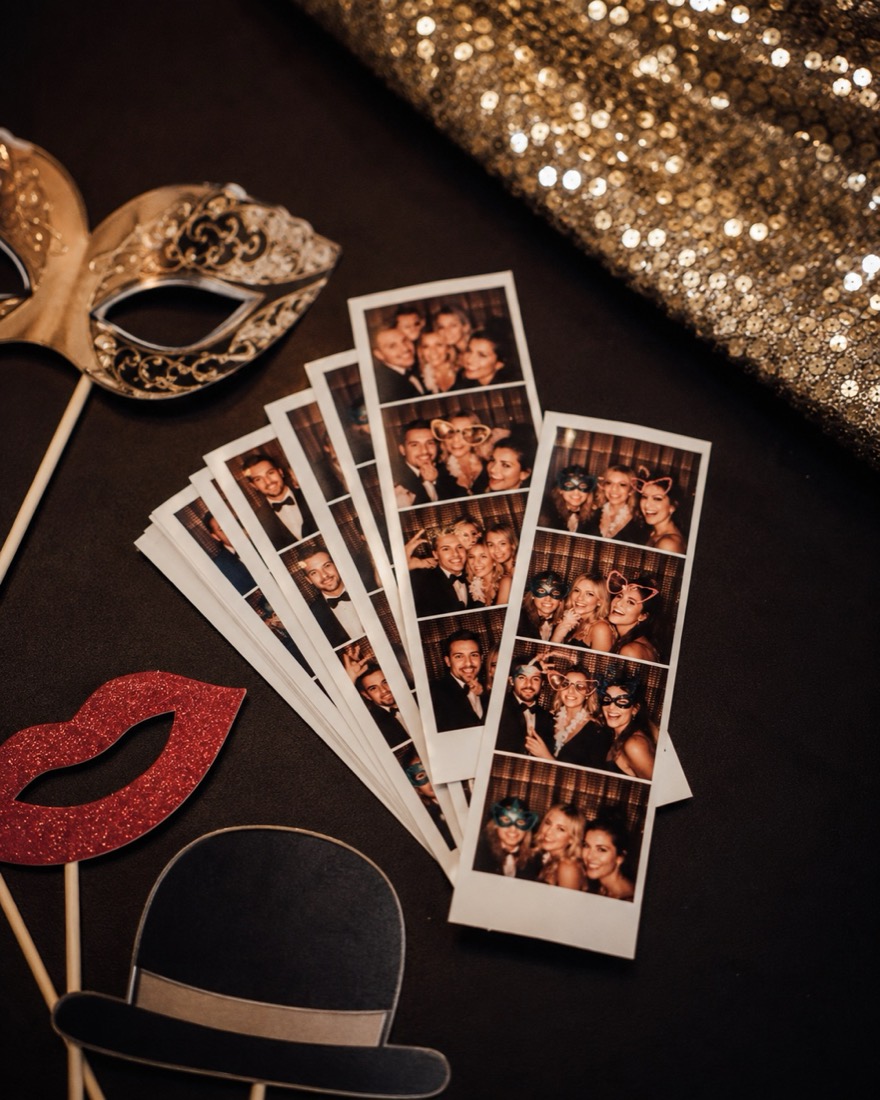 Printed photo strips and props on a table